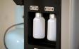 New and Used Oil Bottles on AC Recovery Machine