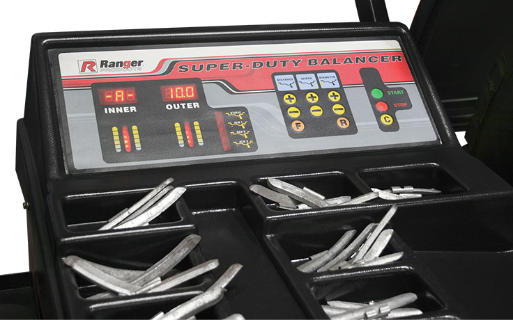 Wheel balancer tray full of Ranger clip-on steel wheel weights