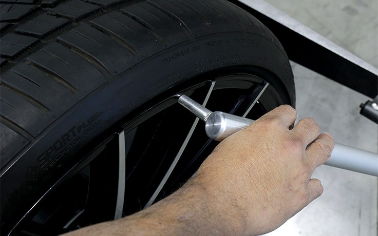 Close-up of data wand on the LS43B wheel balancer